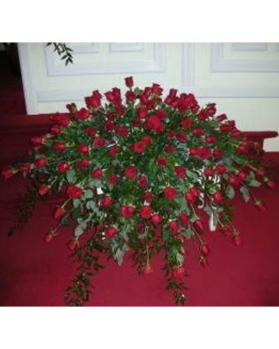 <p data-start="149" data-end="485">When it’s time to honor a life filled with love, strength, and devotion, the <em data-start="226" data-end="246">Cherished Memories</em> casket cover offers a bold and beautiful expression of sympathy. This lush red arrangement symbolizes deep affection, heartfelt respect, and enduring remembrance, making it a powerful final tribute for someone who will never be forgotten.</p>
<p data-start="487" data-end="882">Crafted with care, this sympathy casket cover features a rich display of vibrant red blooms. Classic long-stemmed red roses—known for their timeless symbolism of love—are thoughtfully arranged alongside elegant red carnations and complementary seasonal accents. The result is a dignified and stunning presentation that gracefully blankets the casket, honoring the memory of someone dearly loved.</p>
<p data-start="884" data-end="1268">The all-red color palette brings warmth, passion, and strength to the service, offering a comforting presence during a time of sorrow. Whether chosen by immediate family or close friends, <em data-start="1072" data-end="1092">Cherished Memories</em> is a meaningful and fitting choice for celebrating a life well-lived. The design speaks clearly without words—of loyalty, admiration, and a bond that continues beyond goodbye.</p>
<p data-start="1270" data-end="1562">Ideal for traditional funerals and memorial services, this casket cover serves as a central floral tribute and can be paired with coordinating standing sprays or urn arrangements for a cohesive tribute. Its refined style ensures it will remain a beautiful focal point throughout the ceremony.</p>
<p data-start="1564" data-end="1937">This product is available for <strong data-start="1594" data-end="1617">local delivery only</strong> and will be handcrafted with care by Rosa’s La Hacienda, your trusted Boca Raton florist. Our team ensures every arrangement is fresh, elegant, and delivered on time to your selected service location. We understand how important it is to honor your loved one with dignity, and we are here to help every step of the way.</p>
<p data-start="1939" data-end="2023">Let <em data-start="1943" data-end="1963">Cherished Memories</em> offer a final embrace—strong, heartfelt, and unforgettable.</p>