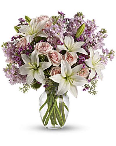<p data-start="130" data-end="465">Capture the feeling of new love or rekindle a lasting flame with Blossoming Romance, a delicate and fragrant bouquet designed to express heartfelt emotion. With its soft pastel tones and lush, seasonal blooms, this arrangement speaks the language of love in full bloom.</p>
<p data-start="467" data-end="782">This elegant bouquet features light pink spray roses, white Asiatic lilies, lavender stock, and lavender waxflower, all carefully accented with fresh greenery. Arranged in a clear glass vase, the design blends softness and sophistication, creating a bouquet that feels intimate, inviting, and effortlessly romantic.</p>
<p data-start="784" data-end="1061">Blossoming Romance is the perfect gift for anniversaries, date nights, Valentine’s Day, or any moment when you want to say “I love you” with beauty and sincerity. Its dreamy palette and graceful textures make it a timeless choice that appeals to both classic and modern tastes.</p>
<p data-start="1063" data-end="1346">Each arrangement is handcrafted by the florists at Rosa’s La Hacienda, your trusted local flower shop in Boca Raton. We offer same-day flower delivery throughout Boca Raton and surrounding communities, with every bouquet arranged and delivered by hand for maximum freshness and care.</p>
<p data-start="1348" data-end="1619">Want to make it even more personal? Add a message at checkout and let your loved one know exactly what’s in your heart. With Blossoming Romance, you're not just giving flowers—you're giving a moment of connection and beauty that lasts long after the blooms begin to open.</p>
<p data-start="1621" data-end="1709">Order today from Rosa’s La Hacienda and let your love blossom in the most beautiful way.</p>
