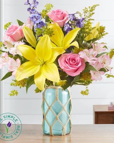 <p data-start="208" data-end="514">Let the spirit of spring bloom indoors with <em data-start="252" data-end="286">Garden Sentiments by Real Simple</em>, a thoughtfully curated bouquet that captures garden-fresh beauty with a coastal twist. This cheerful arrangement is the perfect fusion of nature-inspired color and breezy, Boho design—ideal for gifting or refreshing any space.</p>
<p data-start="516" data-end="932">Brimming with vibrant seasonal blooms, this bouquet showcases a mix of textures and hues in pinks, corals, sunny yellows, and soft whites. Carefully selected by expert florists, flowers may include roses, daisy poms, carnations, alstroemeria, or mini sunflowers, depending on local availability. Each bloom is artfully arranged to feel natural, unstructured, and full of life—just like a spring garden in full swing.</p>
<p data-start="934" data-end="1325">What sets this arrangement apart is its presentation. The flowers are displayed in a sea green glass jar inspired by upcycled coastal décor. A handmade macramé cover adds a thoughtful, eco-friendly detail, evoking relaxed beachside vibes with just the right touch of texture and style. Created in collaboration with Real Simple, this design brings modern simplicity and warmth into any room.</p>
<p data-start="1327" data-end="1658">Whether you’re celebrating a birthday, sending sunshine to a friend, or decorating your own home, <em data-start="1425" data-end="1444">Garden Sentiments</em> delivers joy with a relaxed, contemporary feel. It’s a perfect choice for springtime occasions, thank-you gestures, or housewarming gifts—especially for anyone who loves nature, design, or a bit of Bohemian flair.</p>
<p data-start="1660" data-end="1991">Every <em data-start="1666" data-end="1700">Garden Sentiments by Real Simple</em> bouquet is handcrafted and delivered locally by Rosa’s La Hacienda, a trusted florist proudly serving Boca Raton, Florida. With our commitment to quality and freshness, you can count on every delivery to arrive beautiful, vibrant, and ready to impress—often with same-day service available.</p>
<p data-start="1993" data-end="2154">Celebrate the season with a bouquet that’s as stylish as it is heartfelt. <em data-start="2067" data-end="2086">Garden Sentiments</em> brings the garden and the coast together in one unforgettable gift.</p>