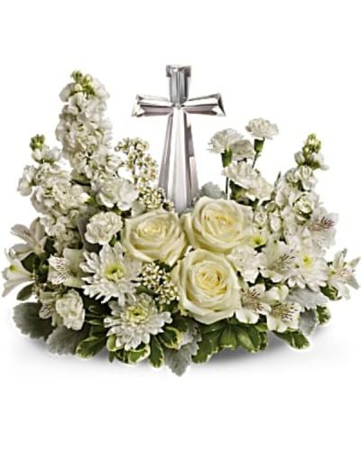 <p data-start="136" data-end="492">Offer solace and serenity with Teleflora’s Divine Peace, a beautifully composed sympathy arrangement that surrounds a radiant crystal cross with soft, pure white blooms. This thoughtful tribute brings comfort, light, and spiritual reflection to those mourning the loss of a loved one.</p>
<p data-start="494" data-end="796">This elegant bouquet features a fragrant mix of white roses, alstroemeria, stock, carnations, and waxflower. Accented with dusty miller and variegated pittosporum, the flowers are artfully arranged around an exclusive Crystal Cross keepsake—an inspiring centerpiece that adds meaning beyond the blooms.</p>
<p data-start="798" data-end="1020">Teleflora’s Divine Peace is an ideal expression of sympathy, faith, and remembrance. Whether sent to a memorial service, funeral, or directly to the home, this arrangement offers both comfort and beauty in a time of grief.</p>
<p data-start="1022" data-end="1277">Each bouquet is handcrafted by Rosa’s La Hacienda, your trusted local florist in Boca Raton. We provide same-day flower delivery throughout Boca Raton and surrounding communities, with every tribute arranged locally and delivered with compassion and care.</p>
<p data-start="1279" data-end="1531">Want to share a personal message of condolence? Add your note during checkout to accompany this graceful tribute. With Teleflora’s Divine Peace, you're sending more than flowers—you’re offering a keepsake of faith and a heartfelt expression of support.</p>
<p data-start="1533" data-end="1619">Order today from Rosa’s La Hacienda and let your sympathy be felt with grace and love.</p>