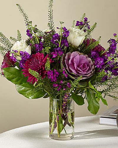 <p data-start="201" data-end="500">When words fall short, let the <em data-start="232" data-end="261">FTD Unbound Romance Bouquet</em> speak for you. This luxurious and imaginative floral arrangement captures the passion and mystery of love with a rich, dramatic palette and bold textures. It’s the perfect way to express your most heartfelt emotions without saying a word.</p>
<p data-start="502" data-end="855">This striking bouquet blends royal purple Cremon mums, delicate Sweet William dianthus, and soft spray stock with the graceful elegance of creamy white roses. Unique floral accents like decorative kale give the design an artistic, garden-fresh feel. Together, these elements create a romantic masterpiece that’s lush, moody, and filled with personality.</p>
<p data-start="857" data-end="1226">Designed to impress, the bouquet is hand-arranged in a classic glass vase that allows each stem to shine. The varied heights and textures draw the eye from every angle, making this arrangement a stunning focal point for any room. Whether it’s placed on a dining table, entryway, or desk, the <em data-start="1149" data-end="1174">Unbound Romance Bouquet</em> fills the space with color, fragrance, and meaning.</p>
<p data-start="1228" data-end="1592">This bouquet is ideal for anniversaries, romantic surprises, or any occasion when you want to make someone feel truly special. It’s also a unique choice for congratulating someone on a big accomplishment or sending a message of admiration. The mix of bold and soft tones symbolizes a deep and layered kind of love—the kind that’s rare, exciting, and uncontainable.</p>
<p data-start="1594" data-end="1987">Handcrafted with care and delivered fresh by Rosa’s La Hacienda in Boca Raton, Florida, every <em data-start="1688" data-end="1713">Unbound Romance Bouquet</em> is made to order using premium blooms. Local delivery ensures your gift arrives in peak condition, bursting with vibrant color and captivating charm. Substitutions may occur based on seasonal availability, but the dramatic beauty and romantic theme will always remain true.</p>
<p data-start="1989" data-end="2134">Dare to give a gift as bold and beautiful as your feelings. Choose the <em data-start="2060" data-end="2089">FTD Unbound Romance Bouquet</em>—where wild passion meets elegant expression.</p>