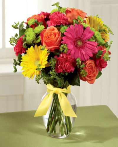 <p data-start="142" data-end="419">Celebrate life’s happy moments with Bright Days Ahead, a bouquet bursting with optimism, energy, and color. Designed to inspire smiles and lift spirits, this vibrant arrangement is perfect for sharing joy with someone special.</p>
<p data-start="421" data-end="761">A lively mix of orange roses, hot pink gerbera daisies, yellow gerbera daisies, hot pink carnations, green button poms, and bupleurum come together in a sunny and uplifting display. Accented with lush greenery and arranged in a clear glass vase tied with a soft yellow satin ribbon, the look is fresh, playful, and heartwarming all at once.</p>
<p data-start="763" data-end="1061">Bright Days Ahead is a wonderful choice for birthdays, congratulations, get-well wishes, or simply to brighten someone’s week. With its bright colors and happy energy, this bouquet brings a little sunshine wherever it goes. It’s a reminder that even small gestures can create unforgettable moments.</p>
<p data-start="1063" data-end="1461">Each bouquet is carefully handcrafted by the floral designers at Rosa’s La Hacienda, your trusted flower shop in Boca Raton. We offer same-day flower delivery throughout Boca Raton and surrounding neighborhoods, always with the personal touch and attention to detail that make our bouquets stand out. You’ll never find mass-produced flowers here—only fresh, hand-selected blooms arranged with care.</p>
<p data-start="1463" data-end="1705">Want to make it even more personal? Add a heartfelt message at checkout and turn this colorful arrangement into a meaningful gift. With Bright Days Ahead, you’re not just sending flowers—you’re sending happiness, beautifully wrapped in color.</p>
<p data-start="1707" data-end="1799">Order today from Rosa’s La Hacienda and help someone you love look forward to brighter days.</p>