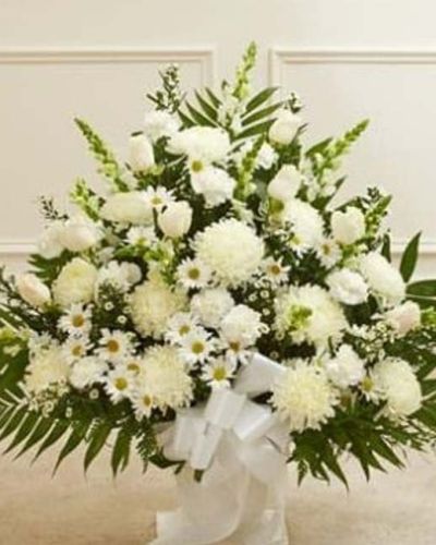 <p data-start="182" data-end="446">Offer a heartfelt expression of sympathy with the quiet beauty of all-white blooms. The <em data-start="270" data-end="309">Touching Tribute Floor Basket – White</em> is a graceful and elegant arrangement, thoughtfully designed to bring comfort and honor the memory of a loved one with dignity and care.</p>
<p data-start="448" data-end="794">This serene display features a hand-selected blend of fresh white roses, mums, snapdragons, and complementary seasonal flowers, all carefully arranged in a classic floor basket. The soft, monochromatic palette evokes purity, peace, and reverence—making it a fitting tribute for memorial services, funeral homes, or celebration of life gatherings.</p>
<p data-start="796" data-end="1075">Whether sent by family, friends, or colleagues, this arrangement delivers a respectful message of support and remembrance. The upright design and lush texture allow it to stand beautifully near the casket or memorial display, creating a calming presence during times of mourning.</p>
<p data-start="1077" data-end="1412">Every <em data-start="1083" data-end="1122">Touching Tribute Floor Basket – White</em> is handcrafted by the skilled florists at Rosa’s La Hacienda in Boca Raton. We offer reliable same-day delivery to funeral homes and service venues throughout Boca Raton and surrounding areas. Your thoughtful gesture will arrive fresh, full, and with the professional care we’re known for.</p>
<p data-start="1414" data-end="1611">Add a personal sympathy message at checkout to accompany your gift. Let this elegant basket help you say what words alone cannot—that you’re thinking of them and honoring a life that meant so much.</p>
<p data-start="1613" data-end="1723">Order today from Rosa’s La Hacienda and send a tribute that offers comfort, beauty, and heartfelt remembrance.</p>