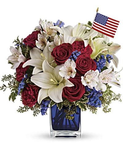 <p data-start="131" data-end="442">Celebrate the spirit of America with a bouquet that honors courage, unity, and pride. America the Beautiful is a striking arrangement designed to commemorate national holidays or to pay tribute to a brave veteran or loved one who served.</p>
<p data-start="444" data-end="753">This bold and meaningful bouquet features red roses, red carnations, white Asiatic lilies, white alstroemeria, and blue statice. Accented with green pitta negra and seeded eucalyptus, the blooms are arranged in a cobalt blue glass cube and accompanied by a small American flag for a finishing patriotic touch.</p>
<p data-start="755" data-end="1057">Perfect for Memorial Day, Fourth of July, Veterans Day, or military homecomings, America the Beautiful brings heartfelt symbolism and fresh beauty together in one elegant design. Whether it’s displayed at a picnic, presented as a tribute, or sent to someone you admire, it’s a gift that speaks volumes.</p>
<p data-start="1059" data-end="1299">Each bouquet is handcrafted by Rosa’s La Hacienda, your trusted local florist in Boca Raton. We offer same-day flower delivery throughout Boca Raton and surrounding areas, with every order prepared locally and delivered with care and pride.</p>
<p data-start="1301" data-end="1492">Want to include a special note? Add your message during checkout to personalize your gift. With America the Beautiful, you're not just sending flowers—you’re honoring values that matter most.</p>
<p data-start="1494" data-end="1600">Order today from Rosa’s La Hacienda and share a patriotic gesture filled with love, gratitude, and beauty.</p>