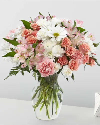 <p data-start="146" data-end="509">Delicate, dreamy, and undeniably romantic—Blush Crush is the kind of bouquet that makes hearts skip a beat. With its soft pinks, creamy whites, and fresh green accents, this arrangement captures the sweet rush of affection and admiration. Whether you're celebrating love, friendship, or a moment of joy, Blush Crush delivers a heartfelt message wrapped in beauty.</p>
<p data-start="511" data-end="941">This charming arrangement includes a graceful mix of blush-toned blooms such as pink roses, pale pink spray roses, and soft white lilies or alstroemeria. Accents of white chrysanthemums and subtle filler flowers add fullness and texture, while fresh greenery provides natural balance and movement. The bouquet is styled in a sleek glass vase, allowing the romantic colors and lush design to take center stage with modern elegance.</p>
<p data-start="943" data-end="1308">Blush Crush is the perfect pick for anniversaries, birthdays, engagements, or “just because” moments that deserve a little extra magic. Its gentle color palette makes it an easy match for any setting—from bedside tables and coffee nooks to workspaces or dinner parties. Sweet without being too formal, this bouquet brings a warm and welcoming glow wherever it goes.</p>
<p data-start="1310" data-end="1640">Hand-crafted and personally delivered by a skilled local florist, each Blush Crush bouquet is prepared with care to ensure every flower arrives fresh and flawless. Rosa’s La Hacienda is proud to offer this customer favorite for delivery throughout the Boca Raton area, helping you send meaningful gifts with style and reliability.</p>
<p data-start="1642" data-end="1805" data-is-last-node="" data-is-only-node="">Make their day a little softer, a little brighter, and a lot more beautiful with Blush Crush—the bouquet that turns a sweet sentiment into something unforgettable.</p>