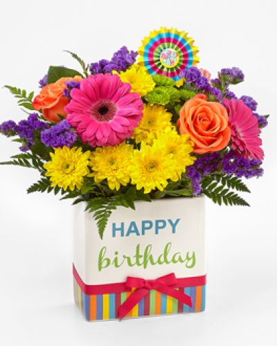 <div class="summary entry-summary">
<div class="woocommerce-product-details__short-description">
<p data-start="175" data-end="461">Make their special day unforgettable with a vibrant surprise that says “Happy Birthday!” in the most joyful way. The FTD® Birthday Brights™ Bouquet is an explosion of color and cheer, thoughtfully arranged to deliver smiles, excitement, and heartfelt celebration with every fresh bloom.</p>
<p data-start="463" data-end="904">At the heart of this dazzling arrangement are bold hot pink gerbera daisies—eye-catching and radiant. They’re beautifully complemented by an eclectic mix of purple gilly flowers, sunny yellow chrysanthemums, bright orange carnations, playful green button poms, and lively bupleurum. Each flower is selected for its freshness and festive hue, coming together in a lush, joyful display that truly captures the spirit of a birthday celebration.</p>
<p data-start="906" data-end="1330">This bouquet is delivered in a keepsake ceramic vase designed just for birthdays. Featuring colorful stripes, cheerful “Happy Birthday” lettering, and a fun pink bow, the vase alone is enough to brighten their day. To top it all off, the bouquet includes a striped birthday pick for an extra pop of party flair. It’s a thoughtful and fun way to honor someone’s big day—whether they’re turning 18, 80, or anything in between.</p>
<p data-start="1332" data-end="1627">Ideal for friends, family, coworkers, or that someone special, this bouquet brings laughter, happiness, and beauty to birthday breakfasts, office desks, kitchen tables, and everywhere in between. It’s a complete birthday gift with all the energy and charm of a well-planned party in floral form.</p>
<p data-start="1629" data-end="1905">Hand-delivered with care by Rosa’s La Hacienda in Boca Raton, each bouquet is crafted by skilled florists to ensure stunning presentation and lasting freshness. Whether you’re sending love from near or far, this birthday bouquet delivers your warm wishes with style and color.</p>
<p data-start="1907" data-end="1982">Let their birthday bloom with joy, and make their celebration truly bright.</p>
</div>
</div>