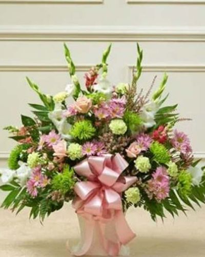 <p data-start="192" data-end="498">In moments of loss, a gentle expression of care can provide lasting comfort. The <em data-start="273" data-end="313">Touching Tribute Floor Basket – Pastel</em> offers a soft and heartfelt way to convey your sympathy with grace and sincerity. Its delicate palette and thoughtful design are a beautiful reflection of love, remembrance, and peace.</p>
<p data-start="500" data-end="857">This arrangement features a hand-gathered selection of fresh pastel roses, gladiolas, snapdragons, mums, carnations, daisy poms, heather, and seasonal greenery. The result is a lush and uplifting floor basket that radiates warmth and compassion. With its tall structure and layered textures, it makes an elegant statement at any memorial or funeral service.</p>
<p data-start="859" data-end="1139">Perfect for sending from friends, family members, or business associates, this basket honors a life well lived and offers support to those left behind. The pastel tones create a sense of calm and comfort, making this a timeless tribute suitable for any type of service or setting.</p>
<p data-start="1141" data-end="1447">Each <em data-start="1146" data-end="1186">Touching Tribute Floor Basket – Pastel</em> is carefully crafted by the expert florists at Rosa’s La Hacienda, your trusted local florist in Boca Raton. We provide same-day delivery to funeral homes and service venues throughout the area, ensuring your sentiment arrives fresh and respectfully presented.</p>
<p data-start="1449" data-end="1657">Include a heartfelt message at checkout to personalize your gift. With every bloom thoughtfully placed, this arrangement offers a meaningful way to say, “I’m with you,” even when you can’t be there in person.</p>
<p data-start="1659" data-end="1762">Order now from Rosa’s La Hacienda and let your floral tribute bring light and love in a time of sorrow.</p>
