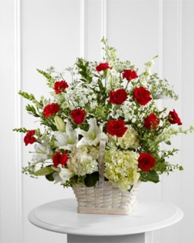 <p data-start="210" data-end="586">Honor a cherished life with a floral tribute that speaks volumes through its elegance and heartfelt beauty. The FTD® In Loving Memory™ Arrangement is a stunning display of love and remembrance, thoughtfully designed to express your deepest sympathy during life’s most tender moments.</p>
<p data-start="588" data-end="1096">This graceful arrangement brings together an exquisite blend of red roses and carnations, symbolizing love and admiration, with a soothing mix of white Oriental lilies, hydrangeas, snapdragons, and larkspur. Accents of Queen Anne’s Lace add a delicate, airy texture that softens the design and evokes purity and peaceful reflection. The combination of bold reds and serene whites strikes a perfect balance between emotional warmth and graceful calm, offering a comforting presence at any service or memorial.</p>
<p data-start="1098" data-end="1554">Every stem is hand-placed in a large whitewashed rectangular basket, chosen for its rustic elegance and timeless appeal. This natural container grounds the arrangement in simplicity and warmth, making it a fitting tribute for a life marked by dignity, compassion, and quiet strength. Whether displayed near the casket, at the front of a church, or in a funeral home, this arrangement provides a moving focal point and a loving reminder of lasting memories.</p>
<p data-start="1556" data-end="1881">Created by the expert florists at Rosa’s La Hacienda, this sympathy arrangement is available for same-day delivery in Boca Raton and the surrounding areas. We understand the importance of honoring a loved one with care and professionalism, ensuring each bouquet is crafted with heartfelt intention and delivered with respect.</p>
<p data-start="1883" data-end="2076">Let the FTD® In Loving Memory™ Arrangement serve as your message of love, respect, and comfort. Add a personal note at checkout to share your thoughts and bring peace to those who need it most.</p>
<p data-start="2078" data-end="2179">Order now from Rosa’s La Hacienda for same-day delivery throughout Boca Raton and nearby communities.</p>