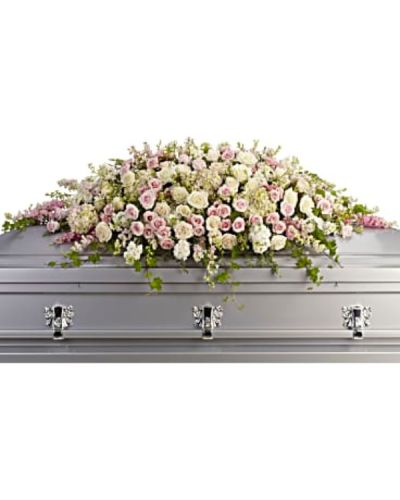 <div id="mark-1" class="m-pdp-tabs-marketing-description">
<p data-start="66" data-end="430">Honor a radiant life with Always Adored, a stunning casket spray that conveys timeless love, beauty, and peace. Soft in tone and elegant in form, this lush floral cascade offers a heartfelt tribute to someone cherished beyond words. Its gentle colors and graceful shape provide comfort during a time of sorrow while celebrating a life filled with warmth and grace.</p>
<p data-start="432" data-end="821">This exquisite casket spray is composed of pale pink hydrangea, blush and white roses, and delicate pink larkspur. White stock and soft waxflower add gentle texture, while trailing ivy, parvifolia eucalyptus, and leatherleaf fern bring movement and natural elegance. The entire arrangement rests atop the casket in a flowing, symmetrical design that speaks to enduring love and admiration.</p>
<p data-start="823" data-end="1081">Always Adored is an ideal choice for honoring a beloved mother, grandmother, sister, daughter, or dear friend. The soft palette of pink, white, and crème represents grace, compassion, and lasting affection—an expression of love that remains even in farewell.</p>
<p data-start="1083" data-end="1385">Each spray is handcrafted by the floral designers at Rosa’s La Hacienda, your trusted local florist in Boca Raton. We offer same-day delivery to funeral homes and memorial venues in and around Boca Raton, ensuring your tribute arrives fresh, full, and ready to honor the occasion with dignity and care.</p>
<p data-start="1387" data-end="1631">You may include a personal message at checkout to share your thoughts, memories, or condolences. At Rosa’s La Hacienda, we are committed to helping families express their love and remembrance with flowers that are both meaningful and beautiful.</p>
<p data-start="1633" data-end="1764" data-is-last-node="" data-is-only-node="">Order today for same-day delivery in Boca Raton and nearby communities. Always Adored is a timeless tribute to a life deeply loved.</p>
</div>