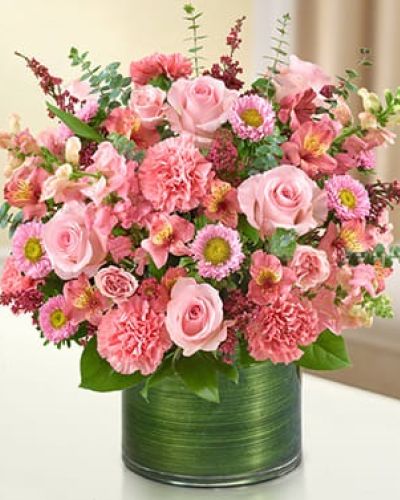 <p data-start="1064" data-end="1316">Honor the life of a loved one with a tribute that speaks to warmth, love, and gentle remembrance. The Treasured Memories Bouquet in pink is a comforting gift that offers beauty in a time of sorrow, helping to express emotions that words cannot capture.</p>
<p data-start="1318" data-end="1749">This vibrant pink arrangement features a graceful mix of fresh roses, spray roses, snapdragons, alstroemeria, carnations, asters, and heather. Each bloom is hand-selected for quality and color harmony, then paired with lush greens including variegated pittosporum, salal, and spiral eucalyptus. The flowers are thoughtfully arranged in a clear glass cylinder vase and finished with a Ti leaf ribbon for a soft, modern presentation.</p>
<p data-start="1751" data-end="2025">This bouquet is a fitting gesture for memorial services, funeral homes, or as a heartfelt delivery to the home of someone grieving. Its cheerful pink tones offer a reminder of the love and joy their memory brings, making it a versatile and comforting expression of sympathy.</p>
<p data-start="2027" data-end="2232">Expertly handcrafted and hand-delivered by Rosa’s La Hacienda, your trusted local florist in Boca Raton, this bouquet is available for same-day delivery to ensure your message arrives when it matters most.</p>
