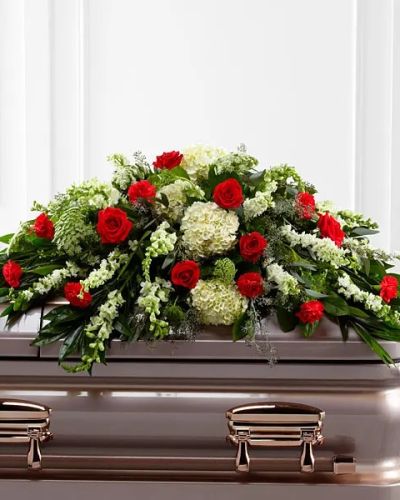 <p data-start="83" data-end="522">Honor a life well lived with The FTD® Sincerity™ Casket Spray, a heartfelt floral tribute that offers comfort, beauty, and quiet strength during times of loss. This refined design is filled with rich, vibrant blooms carefully chosen to convey love, respect, and enduring remembrance. Designed to rest atop the casket, it serves as a touching final farewell that reflects the depth of your emotions and the legacy of the one who has passed.</p>
<p data-start="524" data-end="1046">The arrangement features a striking blend of classic red roses and deep red carnations, symbolizing devotion and affection. These vivid blooms are softened by the delicate presence of white hydrangea, elegant snapdragons, and larkspur, along with airy Queen Anne’s Lace. A thoughtful mix of lush greenery adds natural shape and serenity, helping to create a full and balanced display. Every flower is hand-placed with care to form a graceful cascade across the casket, offering a powerful message of peace and remembrance.</p>
<p data-start="1048" data-end="1430">This spray is ideal for memorial services, funerals, and wakes, offering loved ones a way to express sympathy and respect with dignity and grace. The red and white color palette speaks to the beauty of a life filled with love, while the overall design provides comfort to those in mourning. It is a meaningful way to show your support and to honor someone who made a lasting impact.</p>
<p data-start="1432" data-end="1814">Every Sincerity™ Casket Spray is thoughtfully arranged by the expert florists at Rosa’s La Hacienda, your trusted local florist in Boca Raton. We provide same-day delivery for funeral homes, churches, and private services throughout the Boca Raton area. Each order is handled with the utmost care and professionalism to ensure your flowers arrive fresh and on time for the ceremony.</p>
<p data-start="1816" data-end="1989">You may include a message of sympathy at checkout to accompany your floral tribute. Let Rosa’s La Hacienda help you express love and support when words alone are not enough.</p>
<p data-start="1991" data-end="2050" data-is-last-node="" data-is-only-node="">Same-day delivery available in Boca Raton and nearby areas.</p>