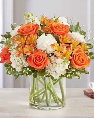 <p data-start="112" data-end="523">Send a burst of sunshine with Sweet Citrus—a lively bouquet that blends bright energy with effortless charm. With its vibrant mix of orange and creamy white blooms, this arrangement is perfect for celebrating life’s joyful moments or simply bringing a smile to someone’s day. Whether it’s a birthday, a thank-you, or just because, Sweet Citrus captures the warmth of your sentiment in a fresh and uplifting way.</p>
<p data-start="525" data-end="1024">This cheerful design features a radiant assortment of orange roses, peachy carnations, soft white lilies, and creamy alstroemeria. Accents of lemon-yellow spray roses and crisp white daisies add to the bouquet’s playful character, while fresh greenery brings a natural balance and light texture. The flowers are loosely gathered in a clear glass cylinder vase, allowing their natural shapes and vibrant colors to shine through. The result is a modern, airy design that feels both joyful and relaxed.</p>
<p data-start="1026" data-end="1366">Sweet Citrus is ideal for all kinds of happy occasions—congratulations, new beginnings, housewarmings, or “thinking of you” moments that deserve a little extra flair. Its citrus-inspired palette is energizing without being overwhelming, making it a beautiful choice for brightening any room, from kitchens to home offices to bedside tables.</p>
<p data-start="1368" data-end="1754">Each bouquet is arranged by hand and delivered fresh by a trusted local florist to ensure quality and care in every petal. Rosa’s La Hacienda is proud to offer Sweet Citrus for delivery throughout the Boca Raton area, where our team is known for thoughtful designs and timely service. With every order, you can trust that your floral gift will arrive looking as vibrant as you imagined.</p>
<p data-start="1756" data-end="1878" data-is-last-node="" data-is-only-node="">Celebrate life’s sweet moments with Sweet Citrus—a bouquet that’s as fresh, fun, and full of color as the people you love.</p>