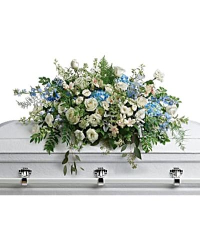 <div id="mark-1" class="m-pdp-tabs-marketing-description">
<p data-start="68" data-end="399">Celebrate the memory of a loved one with Tender Remembrances, a breathtaking standing spray designed to bring comfort, serenity, and a sense of gentle renewal. Like soft clouds drifting through a peaceful sky, this arrangement blends cool blues and crisp whites into a harmonious expression of love, remembrance, and eternal peace.</p>
<p data-start="401" data-end="949">This elegant spray features soothing blue hydrangea and delphinium, paired with graceful white roses, spray roses, and alstroemeria. Accents of white lisianthus, larkspur, stock, and waxflower add texture and movement, while airy dusty miller and asparagus plumosus offer a soft, ethereal finish. Lush greens—including huckleberry, pitta negra, lily grass, dagger fern, and lemon leaf—complete the arrangement with natural balance and fullness. Designed on a standing easel, this piece brings a tranquil presence to any funeral or memorial service.</p>
<p data-start="951" data-end="1250">Tender Remembrances is a meaningful tribute for honoring someone whose life brought calm, wisdom, and quiet strength. Its sky-toned palette conveys peace, hope, and the promise of lasting memories. This spray is especially suited for those who found joy in nature, serenity, or spiritual reflection.</p>
<p data-start="1252" data-end="1610">Handcrafted by the experienced florists at Rosa’s La Hacienda in Boca Raton, every detail is arranged with care and compassion. We offer same-day delivery to funeral homes, places of worship, and service locations throughout Boca Raton and nearby communities. Your floral tribute will arrive fresh, full, and ready to honor the life of someone dearly missed.</p>
<p data-start="1612" data-end="1842">Add a message of sympathy at checkout to share your thoughts and love with the family. At Rosa’s La Hacienda, we are here to help you express what words cannot—with flowers that reflect the soul and beauty of the one you remember.</p>
<p data-start="1844" data-end="1989" data-is-last-node="" data-is-only-node="">Order today for same-day delivery in Boca Raton and surrounding areas. Tender Remembrances is a quiet, powerful expression of love that lives on.</p>
</div>