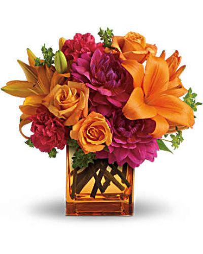 <p data-start="147" data-end="473">Turn up the heat with Summer Chic, a vibrant floral arrangement that captures the essence of summer in full bloom. With its tropical-inspired palette and lively design, this bouquet is pure sunshine in a vase—perfect for adding color and confidence to any celebration.</p>
<p data-start="475" data-end="790">Hot pink dahlias and carnations bring bold energy, while light orange roses and bright orange Asiatic lilies add warmth and radiance. The bouquet is accented with fresh green bupleurum, all arranged in a modern orange glass cube vase that ties it all together with flair. It’s fresh, fiery, and full of personality.</p>
<p data-start="792" data-end="1073">Summer Chic is a fantastic choice for birthdays, summer parties, congratulations, or just to say “thinking of you” in a bold and unforgettable way. With its striking colors and sleek presentation, it brings the carefree feeling of a summer getaway straight into the home or office.</p>
<p data-start="1075" data-end="1449">Every bouquet is handcrafted by the skilled floral team at Rosa’s La Hacienda, your trusted local florist in Boca Raton. We offer same-day flower delivery throughout Boca Raton and nearby neighborhoods, ensuring each bouquet arrives fresh, vivid, and arranged with expert care. We never rely on third-party shippers—just honest craftsmanship and local service you can trust.</p>
<p data-start="1451" data-end="1670">Want to make your gift even more special? Add a heartfelt message at checkout and let your recipient know you're sending them a little summer joy. Summer Chic is bold, fun, and unforgettable—just like the season itself.</p>
<p data-start="1672" data-end="1762">Order today from Rosa’s La Hacienda and send the ultimate summer statement in floral form.</p>