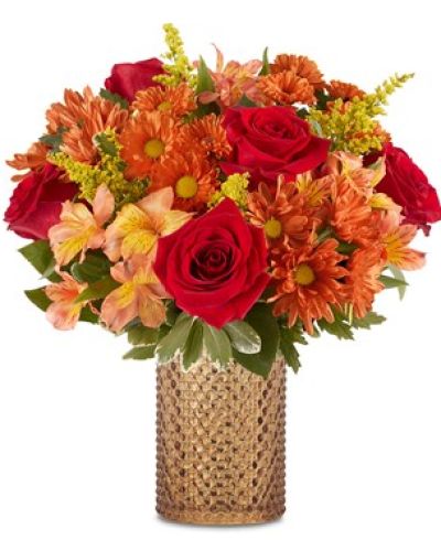 <p data-start="201" data-end="479">Celebrate the cozy brilliance of fall with the <em data-start="248" data-end="274">Rustic Radiance™ Bouquet</em>, a stunning arrangement that captures the spirit of the season in every petal. Whether you're sending a warm hello or decorating your own space, this bouquet glows with nostalgic charm and natural beauty.</p>
<p data-start="481" data-end="881">Overflowing with richly colored blooms, the bouquet showcases vibrant orange roses, golden sunflowers, bronze mums, and warm-toned carnations. Each stem is thoughtfully selected for its hue and texture, creating a harmonious blend that reflects the richness of a golden autumn landscape. Lush seasonal greenery adds depth and contrast, enhancing the natural look and feel of this radiant arrangement.</p>
<p data-start="883" data-end="1213">Presented in a vintage-style amber hobnail glass vase, inspired by Victorian-era elegance, the <em data-start="978" data-end="1004">Rustic Radiance™ Bouquet</em> is as much a decorative piece as it is a heartfelt gift. The vase’s warm amber tone and textured finish make it a timeless keepsake, perfect for displaying future bouquets or seasonal accents around the home.</p>
<p data-start="1215" data-end="1437">This bouquet is a fitting gift for birthdays, thank-you gestures, housewarmings, or any fall celebration. It also makes a thoughtful hostess gift for Thanksgiving or autumn gatherings, adding warmth and charm to the table.</p>
<p data-start="1439" data-end="1748">Each arrangement is hand-designed by the expert florists at Rosa’s La Hacienda in Boca Raton, FL. We take pride in using the freshest blooms available, and while occasional substitutions may be necessary due to local availability, your bouquet will always reflect the same rustic elegance and seasonal spirit.</p>
<p data-start="1750" data-end="1927">With local flower delivery available throughout Boca Raton and nearby communities, the <em data-start="1837" data-end="1863">Rustic Radiance™ Bouquet</em> is a beautiful way to stay connected and spread seasonal cheer.</p>