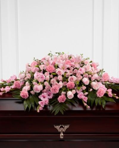 <p data-start="164" data-end="581">Celebrate the life of someone who brought sweetness and compassion into the world with The FTD® Garden of Comfort™ Casket Spray. This elegant arrangement is thoughtfully designed to rest atop the casket, honoring the memory of a loved one with soft pink blooms and lush greenery that reflect tenderness, grace, and heartfelt love.</p>
<p data-start="583" data-end="1017">The spray features a refined selection of pink lilies, gladiolus, roses, and carnations, all arranged in a sweeping display that offers both fullness and softness. Each bloom is carefully chosen for its beauty and meaning, creating a tribute that feels personal, gentle, and deeply sincere. Accents of fresh green foliage add balance and richness, enhancing the natural beauty of the flowers and completing the composition with poise.</p>
<p data-start="1019" data-end="1301">Ideal for memorial services, funerals, or celebration of life ceremonies, this casket spray offers a powerful expression of love and remembrance. Its serene color palette and flowing design make it appropriate for honoring someone known for their kindness, warmth, and inner beauty.</p>
<p data-start="1303" data-end="1708">Each Garden of Comfort™ Casket Spray is handcrafted by the experienced floral team at Rosa’s La Hacienda in Boca Raton. We take care to ensure every arrangement is made fresh to order and delivered directly to the funeral home or service location. Same-day delivery is available throughout Boca Raton and nearby communities, and we coordinate closely with all local funeral providers for seamless service.</p>
<p data-start="1710" data-end="1970">Want to include a message of love and support? Add your note during checkout and we’ll ensure it is delivered with your arrangement. The FTD® Garden of Comfort™ Casket Spray is a timeless way to say goodbye, offering comfort and beauty during a difficult time.</p>
<p data-start="1972" data-end="2087">Order today from Rosa’s La Hacienda and let us help you honor a cherished life with elegance, compassion, and care.</p>