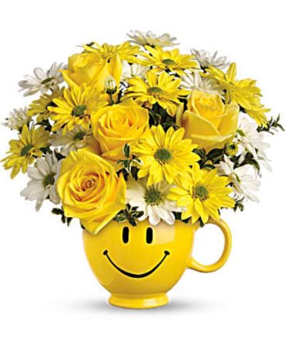 <p data-start="131" data-end="589">Send a cheerful pick-me-up that radiates warmth and positivity with Teleflora’s Be Happy Bouquet. Designed to brighten anyone’s day, this joyful arrangement features vibrant blooms delivered in a keepsake smiley face mug—guaranteed to deliver smiles as wide as its grin. Whether you're sending encouragement, appreciation, or just a surprise to lift someone’s spirits, this bouquet makes happiness bloom.</p>
<p data-start="591" data-end="989">Hand-arranged by our expert florists, this sunny design showcases brilliant yellow roses, playful white and yellow daisy spray chrysanthemums, and fresh oregonia accents. The flowers burst with charm and energy, all nestled inside a bright yellow ceramic mug adorned with an iconic happy face. It’s a gift that brings not only beautiful flowers, but also a reusable reminder of your thoughtfulness.</p>
<p data-start="991" data-end="1288">Perfect for so many occasions—thinking of you, get well soon, teacher appreciation, or even a cheerful birthday surprise—this bouquet is versatile and heartwarming. Its youthful spirit also makes it a hit for kids, while its classic daisies and roses appeal to anyone in need of a little sunshine.</p>
<p data-start="1290" data-end="1652">Teleflora’s Be Happy Bouquet is available for same-day flower delivery in Boca Raton and nearby communities through Rosa’s La Hacienda. As your trusted local florist, we prepare each order with care and deliver it by hand—never boxed, never outsourced. When you shop with Rosa’s, you’re supporting a local business that puts quality and customer happiness first.</p>
<p data-start="1654" data-end="1905">Looking to make your delivery even more personal? Add a custom message during checkout and turn this cheerful bouquet into a moment they’ll never forget. With same-day service and heartfelt design, it’s the perfect way to send smiles across the miles.</p>
<p data-start="1907" data-end="2051">Let Rosa’s La Hacienda help you make someone’s day a little brighter. Order Teleflora’s Be Happy Bouquet today for local delivery in Boca Raton.</p>