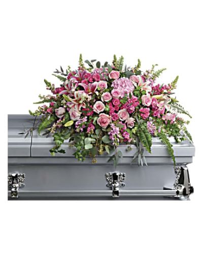 <div class="m-pdp-tabs-description">
<div id="mark-1" class="m-pdp-tabs-marketing-description">
<p data-start="74" data-end="507">Honor a cherished life with the Beautiful Memories Casket Spray, a lush and elegant tribute that captures the tenderness of your most heartfelt memories. Overflowing with soft pink blooms and graceful greenery, this floral arrangement is a symbol of love, peace, and the enduring beauty of the moments shared. It offers comfort to grieving hearts while paying tribute to someone who brought warmth and light into the lives of others.</p>
<p data-start="509" data-end="1110">This breathtaking casket spray features an artful blend of pink hydrangea, pink roses, and pink spray roses, creating a lush base filled with color and grace. Stargazer lilies add a bold, fragrant touch, while carnations, larkspur, snapdragons, and pink stock bring softness, movement, and texture throughout the design. Green ivy trails gently across the arrangement, complemented by sword fern, silver dollar eucalyptus, seeded eucalyptus, and lemon leaf for a natural and serene finish. The design is created to rest beautifully atop the casket, offering a full and feminine expression of farewell.</p>
<p data-start="1112" data-end="1410">Ideal for honoring a beloved mother, grandmother, sister, daughter, or dear friend, this spray evokes feelings of gratitude, admiration, and lasting love. The pink color palette symbolizes gentleness and affection, making it a fitting tribute for someone remembered with deep emotion and reverence.</p>
<p data-start="1412" data-end="1773">Each Beautiful Memories Casket Spray is handcrafted with care by the expert florists at Rosa’s La Hacienda in Boca Raton. We provide same-day delivery to funeral homes and service locations throughout Boca Raton and the surrounding areas. Every stem is placed with intention to ensure a polished, elegant presentation that respects the importance of the moment.</p>
<p data-start="1775" data-end="2004">You can include a personal message of sympathy at checkout to accompany your floral tribute. Let Rosa’s La Hacienda help you honor your loved one with flowers that speak from the heart and reflect the beauty of a life remembered.</p>
<p data-start="2006" data-end="2113" data-is-last-node="" data-is-only-node="">Order today for same-day delivery in Boca Raton and nearby communities. Let your memories bloom with grace.</p>
</div>
</div>