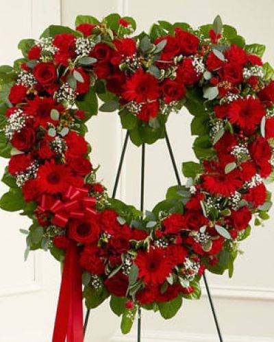 <p>-</p>
<p data-start="160" data-end="481">Pay tribute to a life filled with love, strength, and devotion with the Forever Cherished Floral Heart Tribute – Red. This striking heart-shaped standing spray is a powerful expression of sympathy and respect, honoring a loved one with bold beauty and timeless elegance.</p>
<p data-start="483" data-end="799">Handcrafted by our expert florists, this open-heart design features a stunning blend of fresh red roses, gerbera daisies, and carnations. Accented with delicate baby’s breath, lush salal, seeded eucalyptus, and other fresh greenery, the arrangement creates a moving display of heartfelt remembrance and deep emotion.</p>
<p data-start="801" data-end="1075">Traditionally sent to the funeral home by family or close friends, this standing tribute makes a lasting impression during services, memorials, or wakes. The rich red palette conveys enduring love and admiration, offering comfort through its symbolism and graceful presence.</p>
<p data-start="1077" data-end="1334">Each arrangement is carefully prepared by Rosa’s La Hacienda, your trusted florist in Boca Raton. We offer respectful, same-day delivery to funeral homes throughout Boca Raton and surrounding communities, ensuring your tribute arrives with care and dignity.</p>
<p data-start="1336" data-end="1574">Want to include a personal note? Add your message during checkout to accompany this meaningful display. With the Forever Cherished Floral Heart – Red, you’re sending more than flowers—you’re sharing devotion and honoring a cherished life.</p>
<p data-start="1576" data-end="1674">Order today from Rosa’s La Hacienda and let your heartfelt tribute speak through beauty and grace.</p>