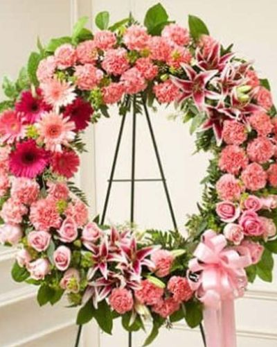 <p data-start="200" data-end="427">Offer a tender tribute filled with warmth, compassion, and remembrance. The <em data-start="276" data-end="318">Serene Sympathies Standing Wreath – Pink</em> is a graceful symbol of your love and support, designed to bring comfort and beauty during a time of sorrow.</p>
<p data-start="429" data-end="788">This elegant standing wreath features a soft blend of pink roses, stargazer lilies, carnations, and seasonal blooms. Accented with salal, seeded eucalyptus, and arranged in a traditional circular form, the design symbolizes eternal love and unbroken remembrance. Mounted on a standing easel, it creates a serene focal point at any funeral or memorial service.</p>
<p data-start="790" data-end="1069">Appropriate for family members, close friends, or business associates, this wreath expresses sympathy in a heartfelt and dignified way. The pink palette represents admiration, gratitude, and gentle affection, offering a peaceful and uplifting presence for those who are grieving.</p>
<p data-start="1071" data-end="1372">Each <em data-start="1076" data-end="1118">Serene Sympathies Standing Wreath – Pink</em> is handcrafted by Rosa’s La Hacienda, your trusted local florist in Boca Raton. We provide same-day delivery to funeral homes and service venues throughout Boca Raton and surrounding areas, ensuring each tribute arrives fresh and respectfully presented.</p>
<p data-start="1374" data-end="1554">Include a personal sympathy message at checkout to complete your thoughtful gift. Let this delicate wreath help you honor a beautiful life and show your continued love and support.</p>