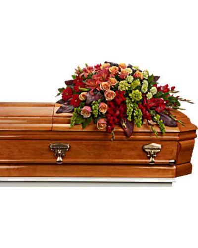 <div id="mark-1" class="m-pdp-tabs-marketing-description">
<p data-start="63" data-end="394">Celebrate a vibrant life with <em data-start="93" data-end="110">A Fond Farewell</em>, a stunning casket spray that radiates warmth, color, and heartfelt remembrance. Designed to bring majesty and beauty to the service, this bold arrangement is a touching tribute for someone whose presence lit up every room and left lasting memories in the hearts of those they loved.</p>
<p data-start="396" data-end="821">This magnificent spray features a rich blend of green miniature hydrangea, orange roses, and deep orange asiatic lilies. Red gerberas and gladioli add dramatic flair and depth, while green carnations and bells of Ireland offer fresh texture and symbolic hope. Accented with lush greenery, this full, cascading design creates a dynamic and uplifting presentation atop the casket, honoring a life of joy, strength, and passion.</p>
<p data-start="823" data-end="1154"><em data-start="823" data-end="840">A Fond Farewell</em> is ideal for services where celebration and remembrance come together. The warm tones of orange and red symbolize admiration and devotion, while the fresh green elements suggest renewal and eternal love. This spray is especially fitting for honoring someone with a bold spirit, generous heart, and vibrant legacy.</p>
<p data-start="1156" data-end="1423">Each arrangement is handcrafted with care by the experienced floral team at Rosa’s La Hacienda in Boca Raton. We provide same-day delivery to local funeral homes and service venues, ensuring your tribute arrives fresh, full, and presented with dignity and compassion.</p>
<p data-start="1425" data-end="1654">You may include a personal message of remembrance at checkout to accompany your floral gift. At Rosa’s La Hacienda, we are honored to help families express love, gratitude, and farewell through thoughtfully designed arrangements.</p>
<p data-start="1656" data-end="1816" data-is-last-node="" data-is-only-node="">Order today for same-day delivery in Boca Raton and surrounding communities. <em data-start="1733" data-end="1750">A Fond Farewell</em> is a vivid and beautiful way to honor a truly unforgettable life.</p>
</div>