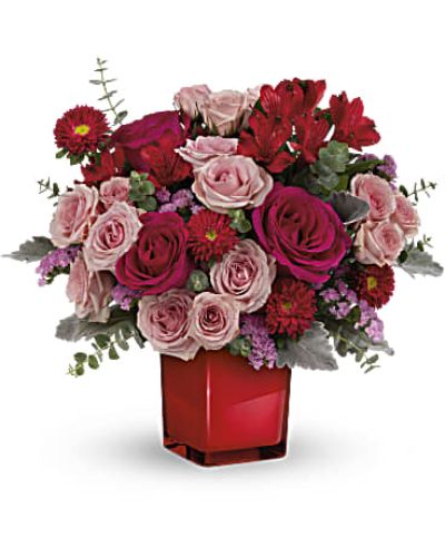 <p data-start="123" data-end="542">Make a bold and beautiful statement with the Loving Bunch—a vivid bouquet designed to speak straight from the heart. Bursting with vibrant pinks and passionate reds, this arrangement delivers an unforgettable message of love, admiration, or simply “I’m thinking of you.” Whether you're celebrating a birthday, surprising someone just because, or sending romantic vibes, the Loving Bunch captures emotion in every petal.</p>
<p data-start="544" data-end="1000">This high-style design features hot pink roses, delicate pink spray roses, and striking red alstroemeria paired with red Matsumoto asters for depth and texture. Pink sinuata statice adds a soft pop of color, while dusty miller and spiral eucalyptus lend cool-toned contrast and graceful movement. The entire bouquet is presented in a deep crimson glass cube that glows with modern elegance—designed to double as a sleek candleholder after the flowers fade.</p>
<p data-start="1002" data-end="1381">Ideal for anniversaries, Valentine’s Day, Galentine’s celebrations, or simply making someone’s day brighter, the Loving Bunch is a fashionable floral gift that leaves a lasting impression. Its color palette is bold yet balanced, offering a chic, contemporary twist on traditional romantic arrangements. It’s the kind of bouquet that turns heads and warms hearts at the same time.</p>
<p data-start="1383" data-end="1687">Each bouquet is artfully arranged and hand-delivered by a local florist to ensure maximum freshness and visual impact. Rosa’s La Hacienda is proud to offer this standout design for delivery throughout the Boca Raton area, where our expert team curates every floral gift with care and attention to detail.</p>
<p data-start="1689" data-end="1821" data-is-last-node="" data-is-only-node="">Send a stunning reminder of how much they mean to you with the Loving Bunch—a vivid blend of beauty, style, and heartfelt sentiment.</p>