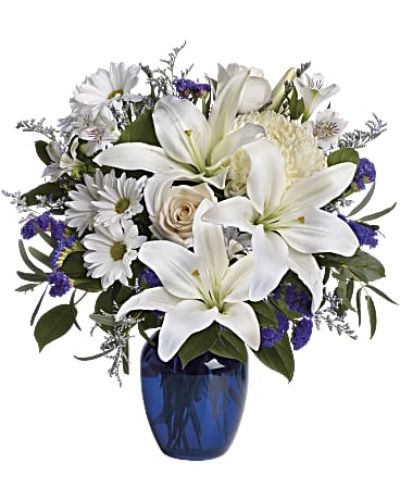 <p data-start="120" data-end="485">Send a graceful message of serenity and sincerity with Beautiful in Blue, an elegant floral arrangement that combines soft whites with soothing blues. Whether you're offering comfort, celebrating a special moment, or simply showing that you care, this bouquet delivers a calm and thoughtful presence.</p>
<p data-start="487" data-end="816">This stunning design features blue hydrangea, crème roses, white lilies, white alstroemeria, and a mix of yellow and white chrysanthemums. Eucalyptus, limonium, and other fresh greens add texture and balance to the arrangement, all beautifully displayed in a striking blue glass vase that enhances the soft, serene color palette.</p>
<p data-start="818" data-end="1078">Beautiful in Blue is a meaningful choice for sympathy gestures, new beginnings, birthdays, or to send peace and love in times when words fall short. The blend of cool tones and delicate florals creates a peaceful atmosphere that brings both beauty and comfort.</p>
<p data-start="1080" data-end="1424">Every bouquet is handcrafted by the floral designers at Rosa’s La Hacienda, your trusted florist in Boca Raton. We offer same-day flower delivery throughout Boca Raton and surrounding areas, ensuring your arrangement arrives fresh, fragrant, and beautifully presented. Each order is made locally and delivered with care by our experienced team.</p>
<p data-start="1426" data-end="1691">Want to add a personal note? Include a heartfelt message at checkout to create a more memorable and comforting gift. With its calming colors and elegant composition, Beautiful in Blue offers a timeless way to express compassion, gratitude, or heartfelt celebration.</p>
<p data-start="1693" data-end="1800">Order today from Rosa’s La Hacienda and share the quiet beauty of blue and white blooms arranged with love.</p>