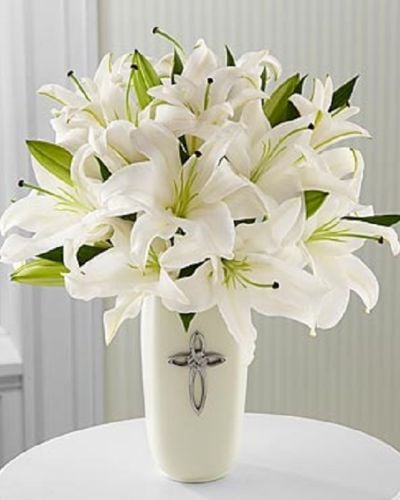 <p data-start="129" data-end="469">When words fall short, Faithful Blessings offers a serene and meaningful way to express your heart. This elegant all-white arrangement is a symbol of purity, peace, and enduring love—perfect for honoring life’s sacred moments or comforting someone during a time of reflection.</p>
<p data-start="471" data-end="734">Featuring radiant white lilies, this bouquet is arranged in a white ceramic vase and accented with a decorative cross, adding a spiritual touch to its graceful presence. The design is all-around, making it ideal for placing on a table, altar, or memorial display.</p>
<p data-start="736" data-end="994">Faithful Blessings is a fitting choice for religious celebrations, confirmations, sympathy tributes, weddings, or special anniversaries. Its clean lines and symbolic elements create a timeless and respectful presentation for life’s most meaningful occasions.</p>
<p data-start="996" data-end="1260">Every arrangement is handcrafted by the floral designers at Rosa’s La Hacienda, your trusted florist in Boca Raton. We offer same-day flower delivery throughout Boca Raton and the surrounding communities, with each bouquet arranged locally and delivered with care.</p>
<p data-start="1262" data-end="1482">Want to personalize your delivery? Add a heartfelt message during checkout to accompany this graceful tribute. With Faithful Blessings, you're sending more than flowers—you’re sharing faith, comfort, and timeless beauty.</p>
<p data-start="1484" data-end="1583">Order today from Rosa’s La Hacienda and offer a gesture of peace and grace that will be remembered.</p>